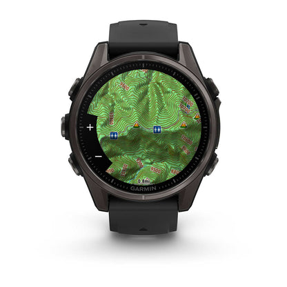 Garmin Fenix 8 AMOLED Edition smartwatch displaying a detailed topographic map with contour lines and elevation markers.