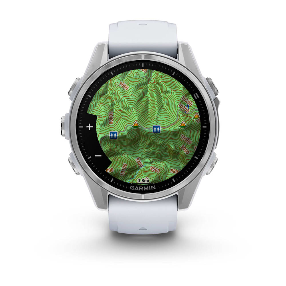 Garmin Fenix 8 AMOLED Edition smartwatch displaying a detailed topographic map with elevation contours and navigation icons.