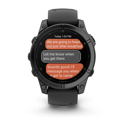 Garmin Fenix E AMOLED Edition displaying text messages on its screen, indicating plans for a trip.