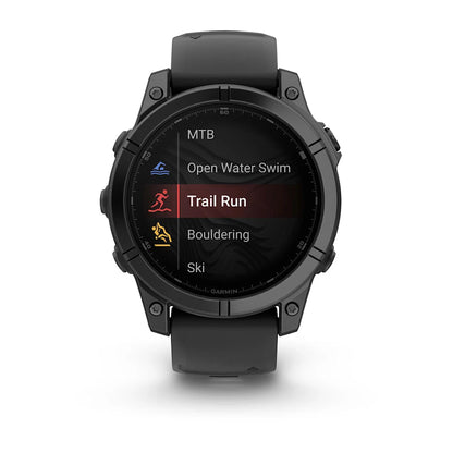 Garmin Fenix E AMOLED Edition smartwatch displaying various activity options including Trail Run, MTB, Open Water Swim, Bouldering, and Ski.
