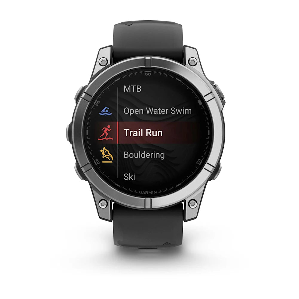 Garmin Fenix E AMOLED Edition displaying various activity modes including Trail Run, Open Water Swim, MTB, Bouldering, and Ski on its screen.