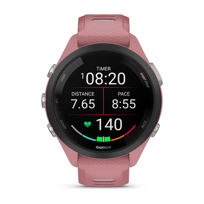 Garmin Forerunner 265S smartwatch displaying timer, distance of 7.65 miles, pace of 8:55 per mile, and heart rate of 140 beats per minute.