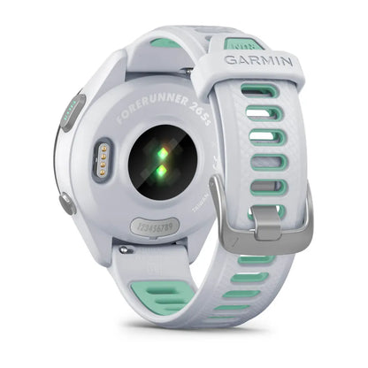 Back view of the Garmin Forerunner 265S smartwatch, featuring a white and mint green design with a heart rate sensor and adjustable strap.
