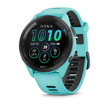 Garmin Forerunner 265 smartwatch displaying metrics, featuring a turquoise strap and a round black face with digital readouts.
