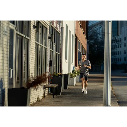 Garmin Forerunner 570 lifestyle – stretching with watch visible