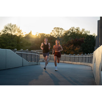 Garmin Forerunner 970 lifestyle – cyclist glancing at watch