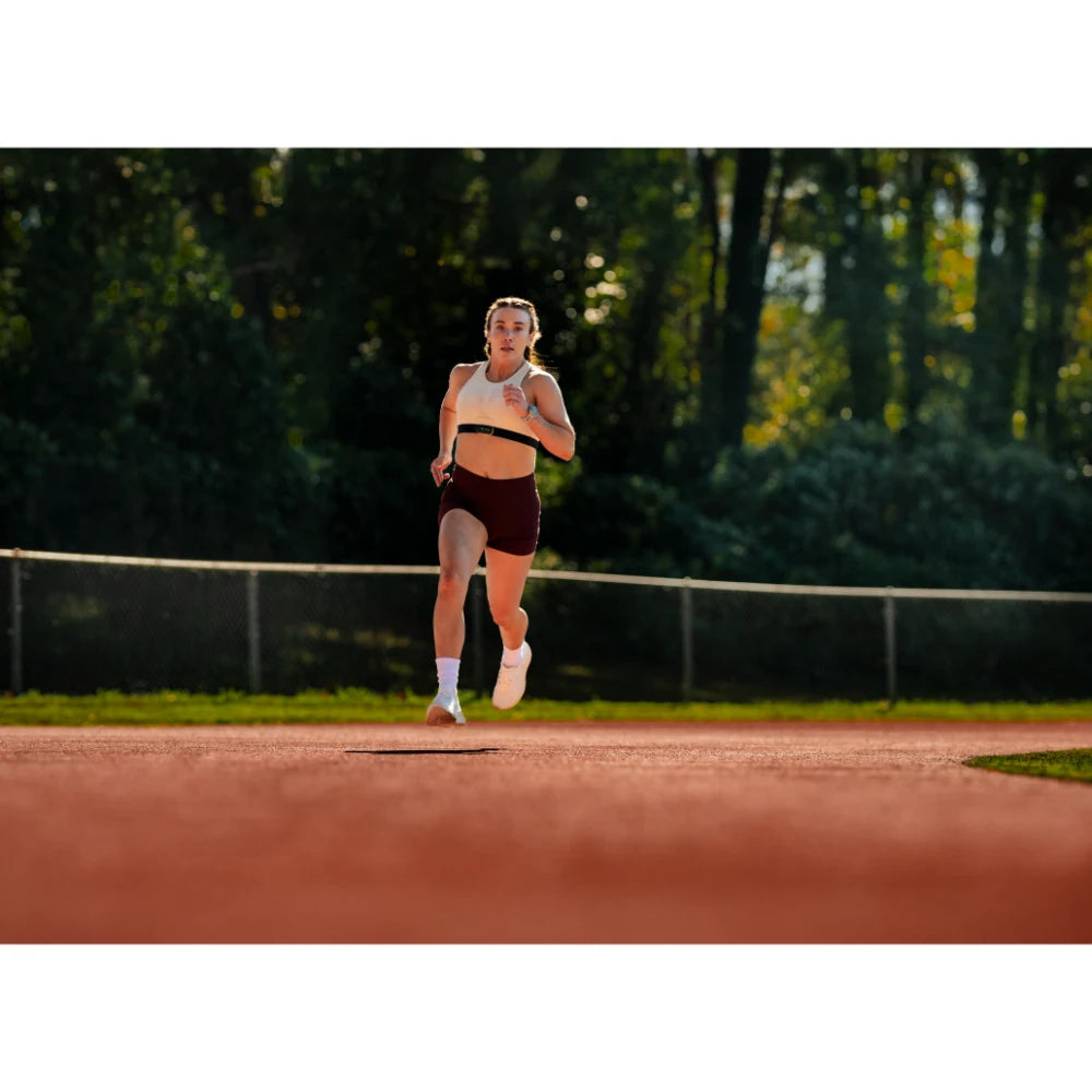 Garmin Forerunner 970 lifestyle – yoga/stretch scene featuring watch