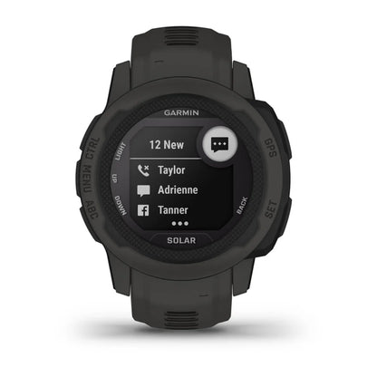 Garmin Instinct 2S Solar smartwatch displaying notifications with a dark green strap and black screen.