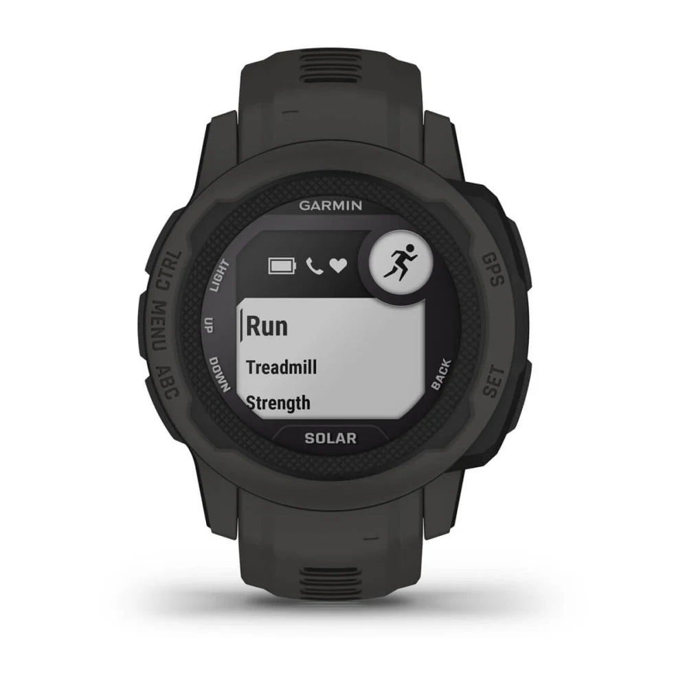 Garmin Instinct 2S Solar smartwatch displaying workout options including 'Run', 'Treadmill', and 'Strength' on its screen.