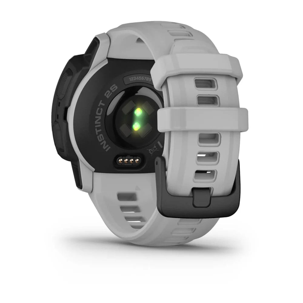 Garmin Instinct 2S Solar smartwatch showing the back with a green heart rate sensor and a white strap.