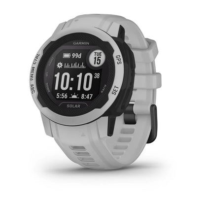 Garmin Instinct 2S Solar smartwatch displayed at an angle, featuring a round black face with white accents, showing the time and various metrics on the screen.