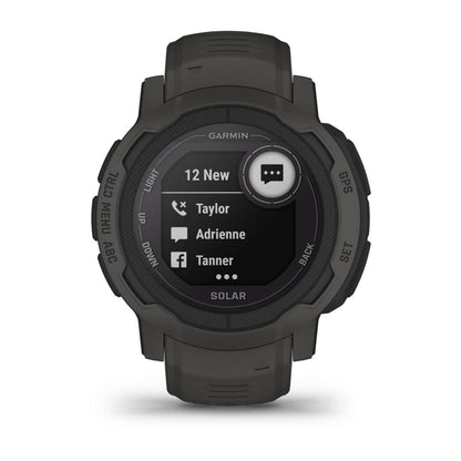 Garmin Instinct 2 Solar smartwatch displaying notifications with a black and green design.