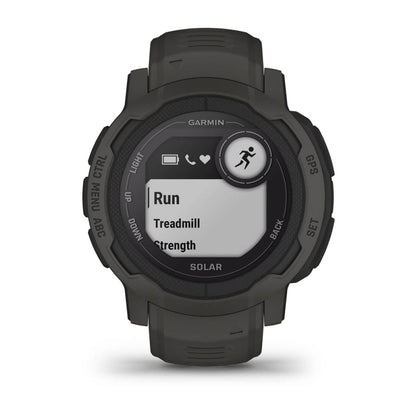 Garmin Instinct 2 Solar smartwatch displaying workout options including Run, Treadmill, and Strength.