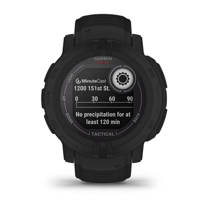 Garmin Instinct 2 Solar Tactical Edition smartwatch displaying weather information with a black strap and tactical features.