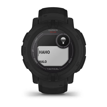 Garmin Instinct 2 Solar Tactical Edition smartwatch displaying 'HAHO' and 'HALO' options on its screen, featuring a rugged black design.
