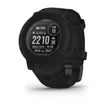 Garmin Instinct 2 Solar Tactical Edition smartwatch displaying various tactical features and data on a black screen.