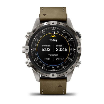 Garmin MARQ Adventurer (Gen 2) smartwatch displaying sunrise and sunset times with a brown leather strap.