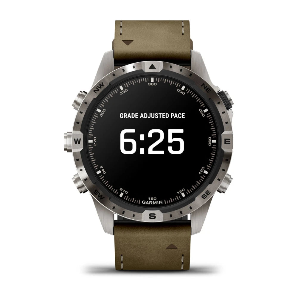 Garmin MARQ Adventurer (Gen 2) smartwatch displaying 'GRADE ADJUSTED PACE' with a time of 6:25 on a black screen, featuring a stainless steel case and a brown leather strap.