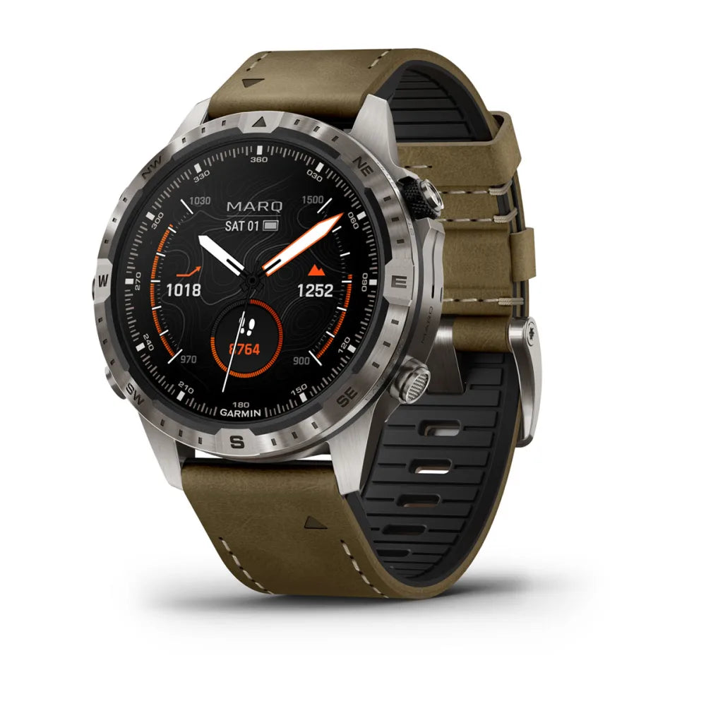 Garmin MARQ Adventurer (Gen 2) smartwatch featuring a black dial with orange accents and a two-tone strap, displayed at an angle.