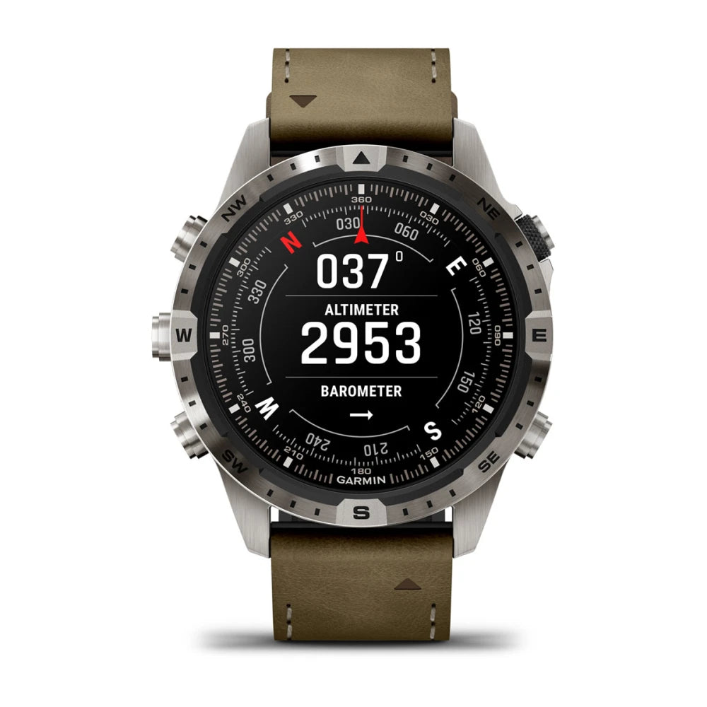Garmin MARQ Adventurer (Gen 2) smartwatch displaying altimeter and barometer readings with a metal bezel and olive green leather strap.