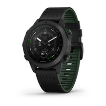 Garmin MARQ Golfer (Gen 2) Carbon Edition smartwatch featuring a black and green design, displaying golf-related metrics on the screen.