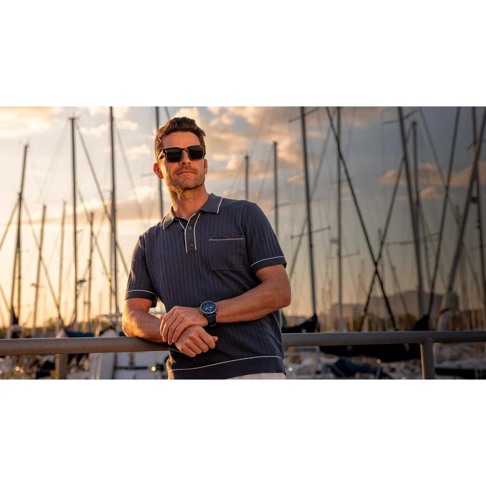 Garmin quatix 8 – lifestyle shot on deck with watch