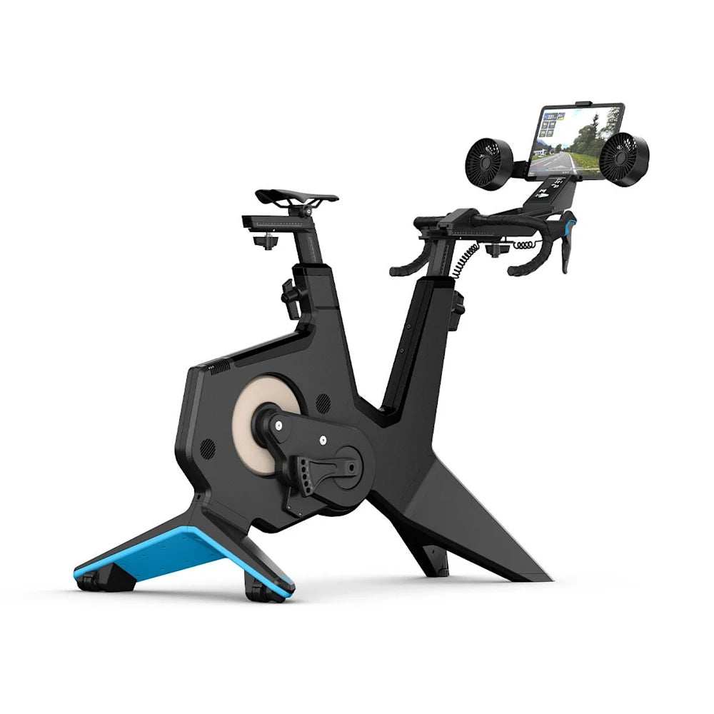 CycleOps indoor bike with black frame and blue accents, featuring dual fans and built-in screen for cycling workouts.