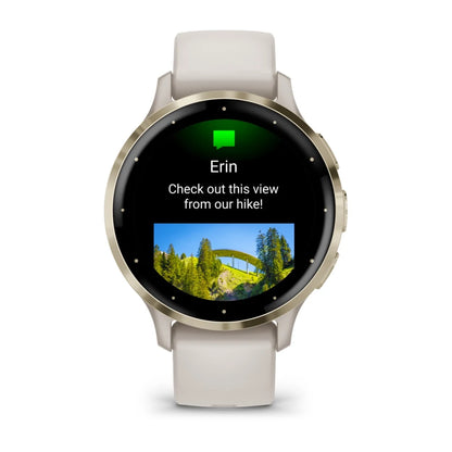 Garmin Venu 3S smartwatch displaying a message from Erin with a photo of a scenic view from a hike.
