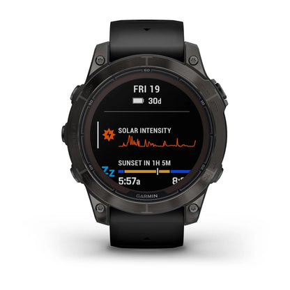 Garmin Fenix 7 Pro Sapphire Solar Edition smartwatch displaying solar intensity and sunset time on its screen.