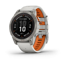Garmin Fenix 7 Pro Sapphire Solar Edition smartwatch displaying activity metrics with a gray and orange strap.