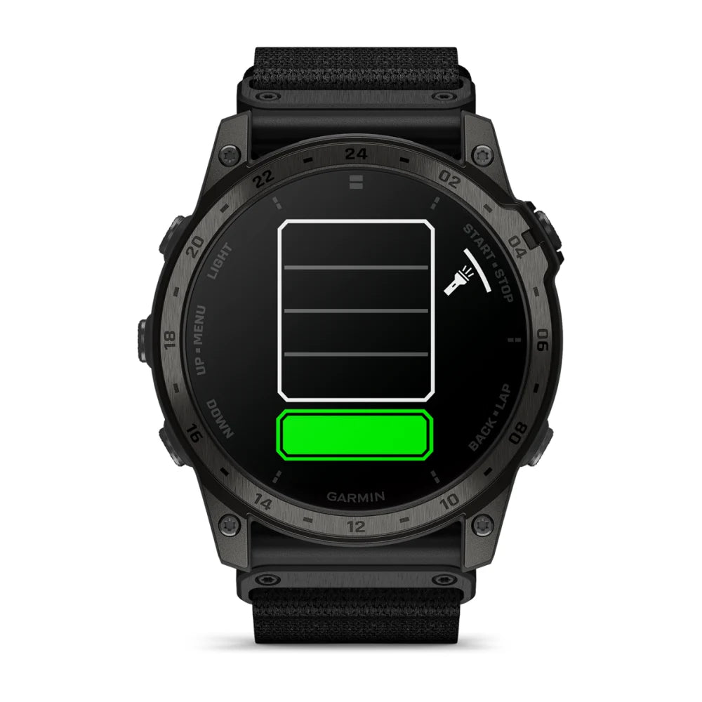 Garmin tactix 7 AMOLED Edition smartwatch displaying a low battery icon with a green charging bar.