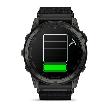 Garmin tactix 7 AMOLED Edition smartwatch displaying a low battery icon with a green charging bar.