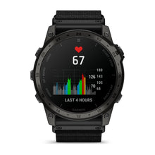 Garmin tactix 7 AMOLED Edition smartwatch displaying heart rate of 67 and a colorful graph indicating activity over the last 4 hours.