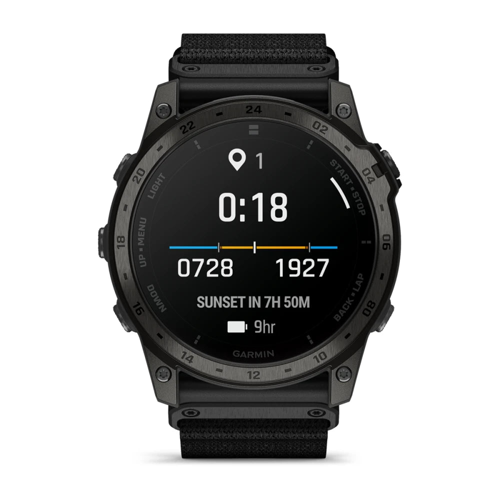 Garmin tactix 7 AMOLED Edition smartwatch displaying time, location, and sunset information on a dark screen with a black strap.
