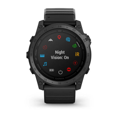 Garmin tactix 7 Standard Edition smartwatch displaying the 'Night Vision: On' setting on its screen, featuring various icons and a black strap.