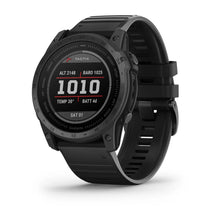 Garmin tactix 7 Standard Edition smartwatch displaying altitude, barometric pressure, temperature, battery life, and date on its screen.