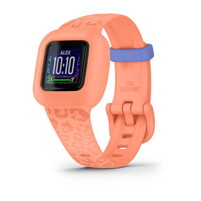 Garmin vivofit jr. 3 in coral color with a leopard print band, displaying the time and activity tracking features on the screen.