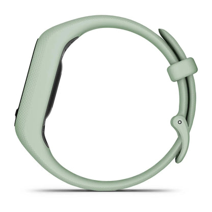 Garmin vivosmart 5 fitness tracker in a soft green color, shown from the side.