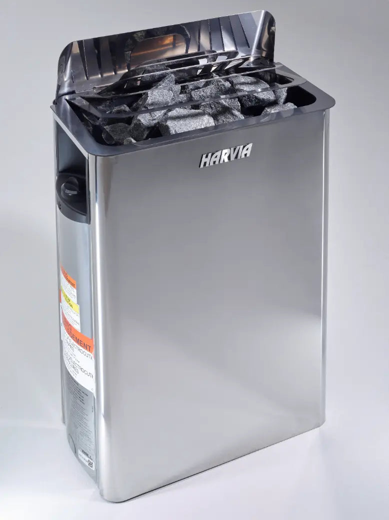 Harvia stainless steel sauna heater with rocks inside and lid open.