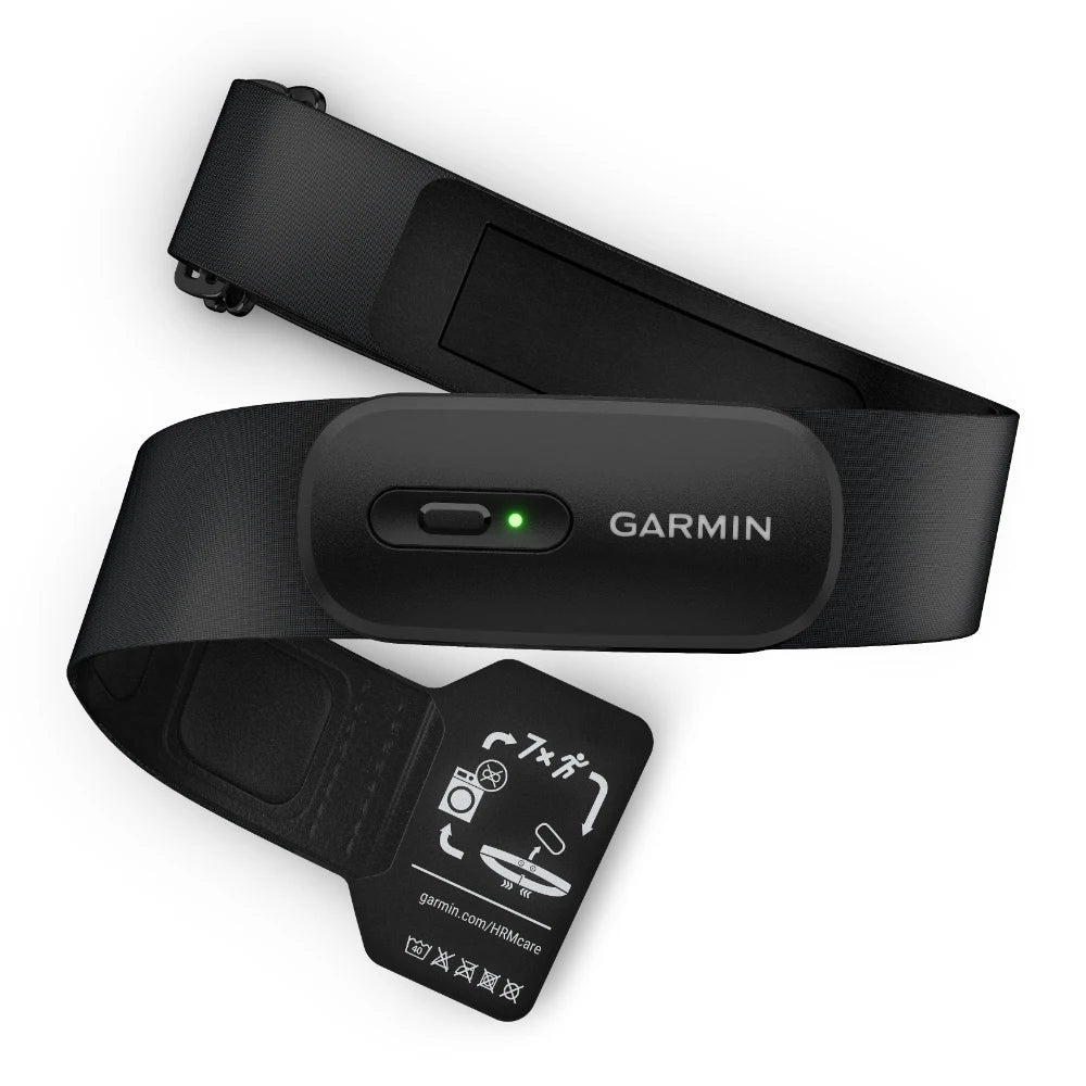 Garmin HRM 200 heart rate monitor with a black strap and an indicator light, featuring care instructions on a tag.