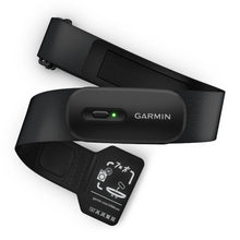 Garmin HRM 200 heart rate monitor with a black strap and an indicator light, featuring care instructions on a tag.