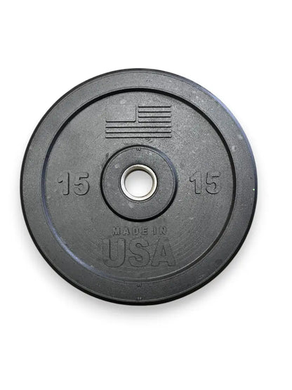Black rubber bumper plate with 15 lb weight marking on each side, center hole, and "Made in USA" text embossed on the face.