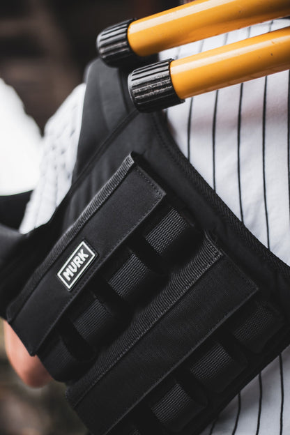 Close-up of a black MVRK tactical pouch with MOLLE straps.