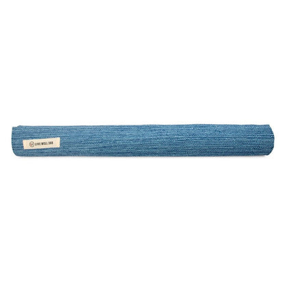 Blue rolled yoga mat with a Live Well 360 label.
