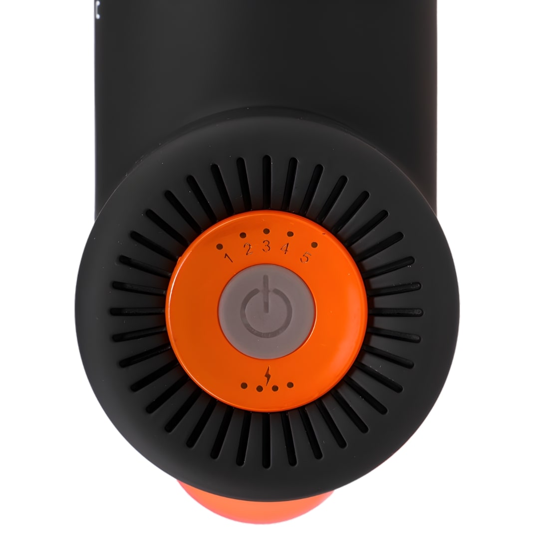 Black and orange massage gun dial with five-speed settings.