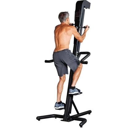VersaClimber TS Magnetic – man powering through intense vertical climb on black magnetic resistance machine