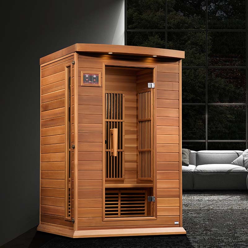 Maxxus MX-K206-01 Far Infrared Sauna featuring a wooden design, with an open door showcasing the interior and a modern living room setting in the background.