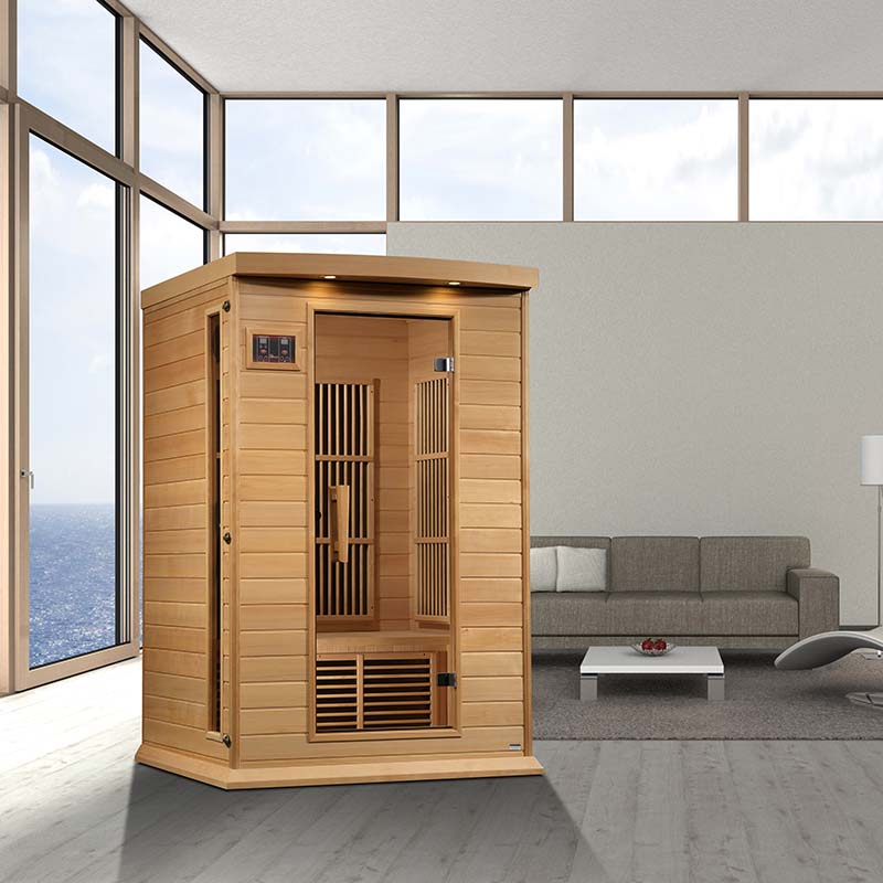Maxxus MX-K206-01 Far Infrared Sauna displayed in a modern living room with large windows and a comfortable sofa.