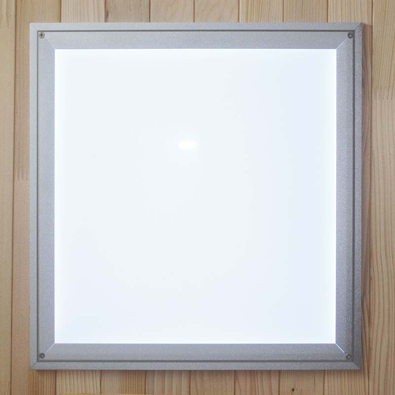 Maxxus MX-K306-01 Far Infrared Sauna control panel featuring a sleek, illuminated design against a wooden background.