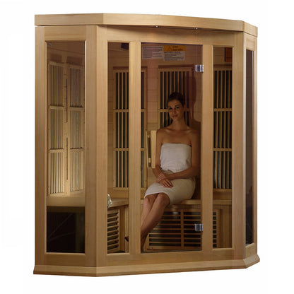 Maxxus MX-K356-01 Far Infrared Corner Sauna with a woman sitting inside, wrapped in a towel, showcasing the sauna's wooden design and glass panels.